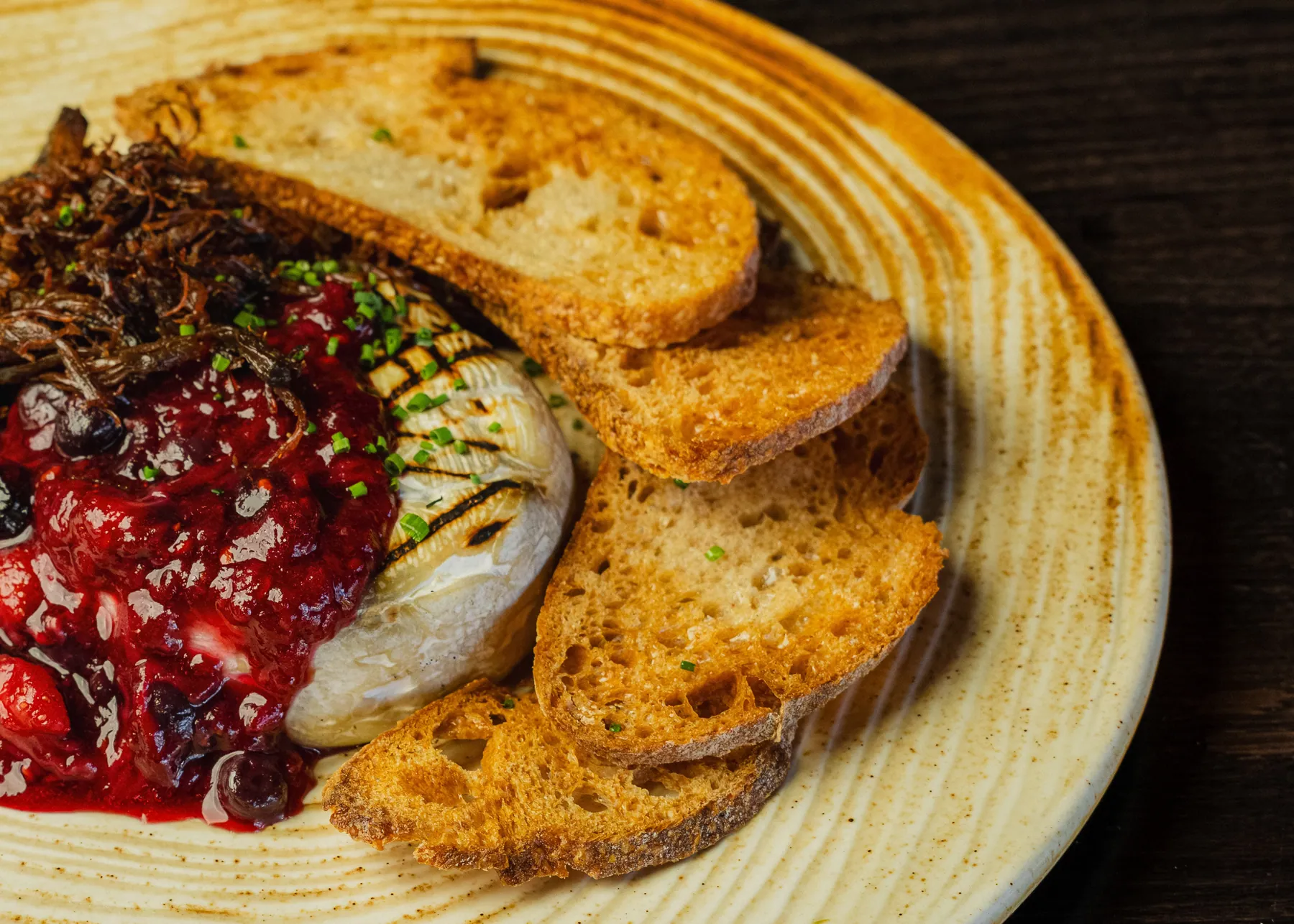Brie cheese and toasted bread from the shared Origen food collection